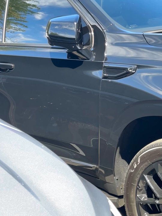 Blackout AZ Queen Creek - "Yukon" over spray from painted the badging in place instead of removing completely like we talked about. All emblems look like this. - Auto Detailing Near Me - Mesa, Arizona