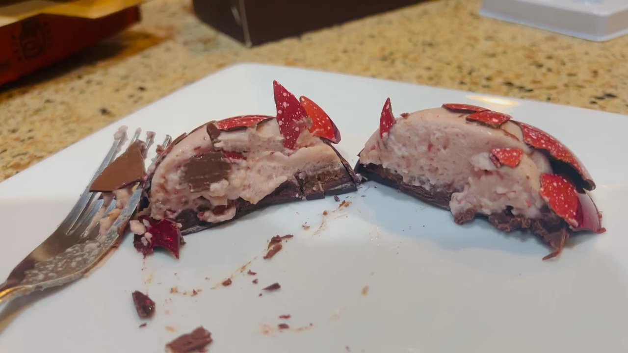 MAE Fine Foods - Inside the strawberry MAElo.  Creamy mousse on top of a rich chocolate ganache. Insanely good!! - Chocolatiers & Shops Near Me - Avondale, Arizona