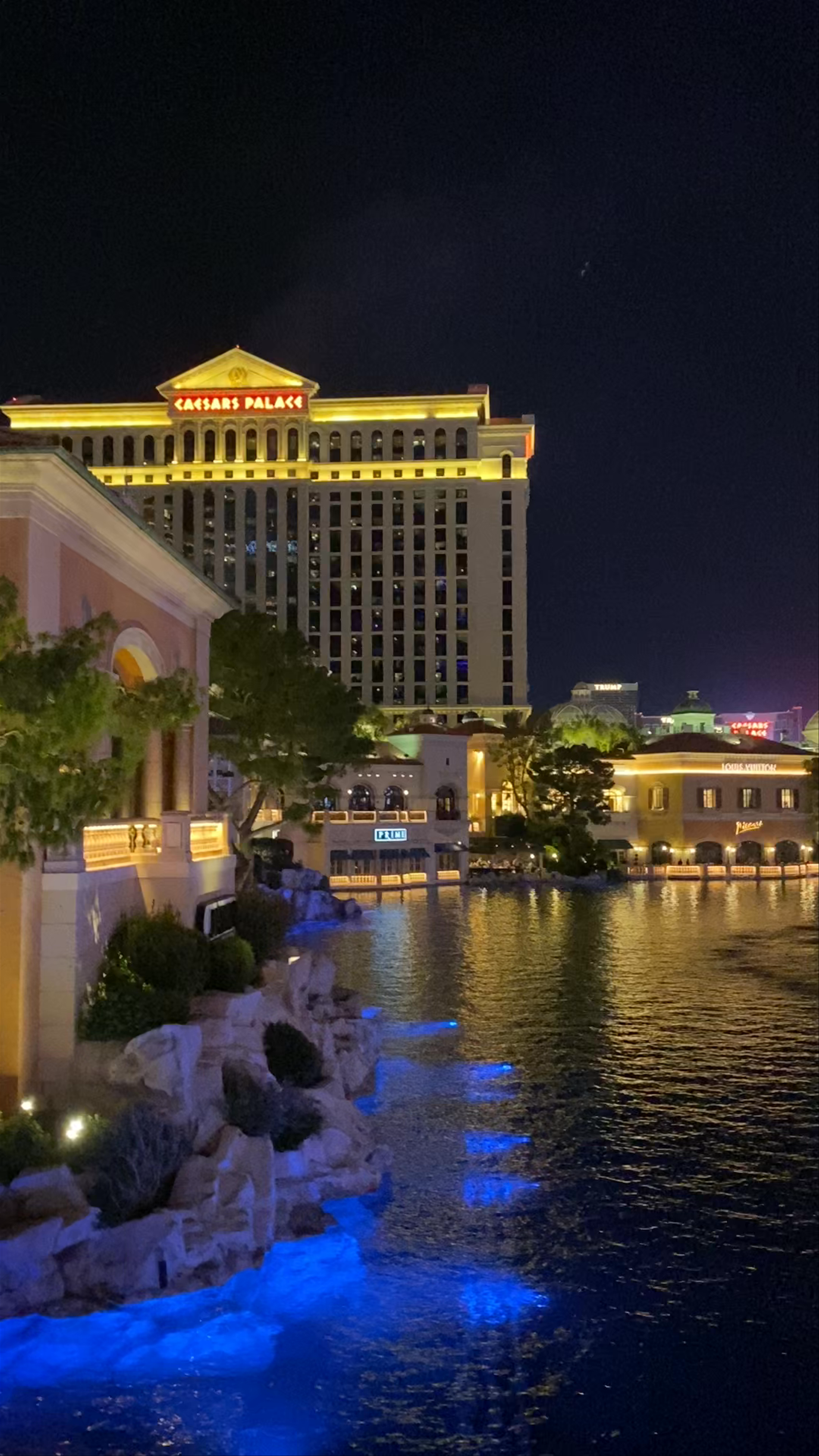 Las Vegas Strip Nightlife: Illuminated Iconic Casinos and Vibrant Water Reflections