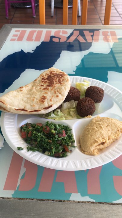 Gyro House - Falafel plate. Eating just outside restaurant. - Mediterranean Near Me - Miami, Florida