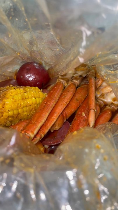 Crab Du Jour - Instagram @Kurlykonnoisseur |1/2lb shrimp and 1/2 lb snow crab add smoked sausage - Seafood Near Me - Charlotte, North Carolina