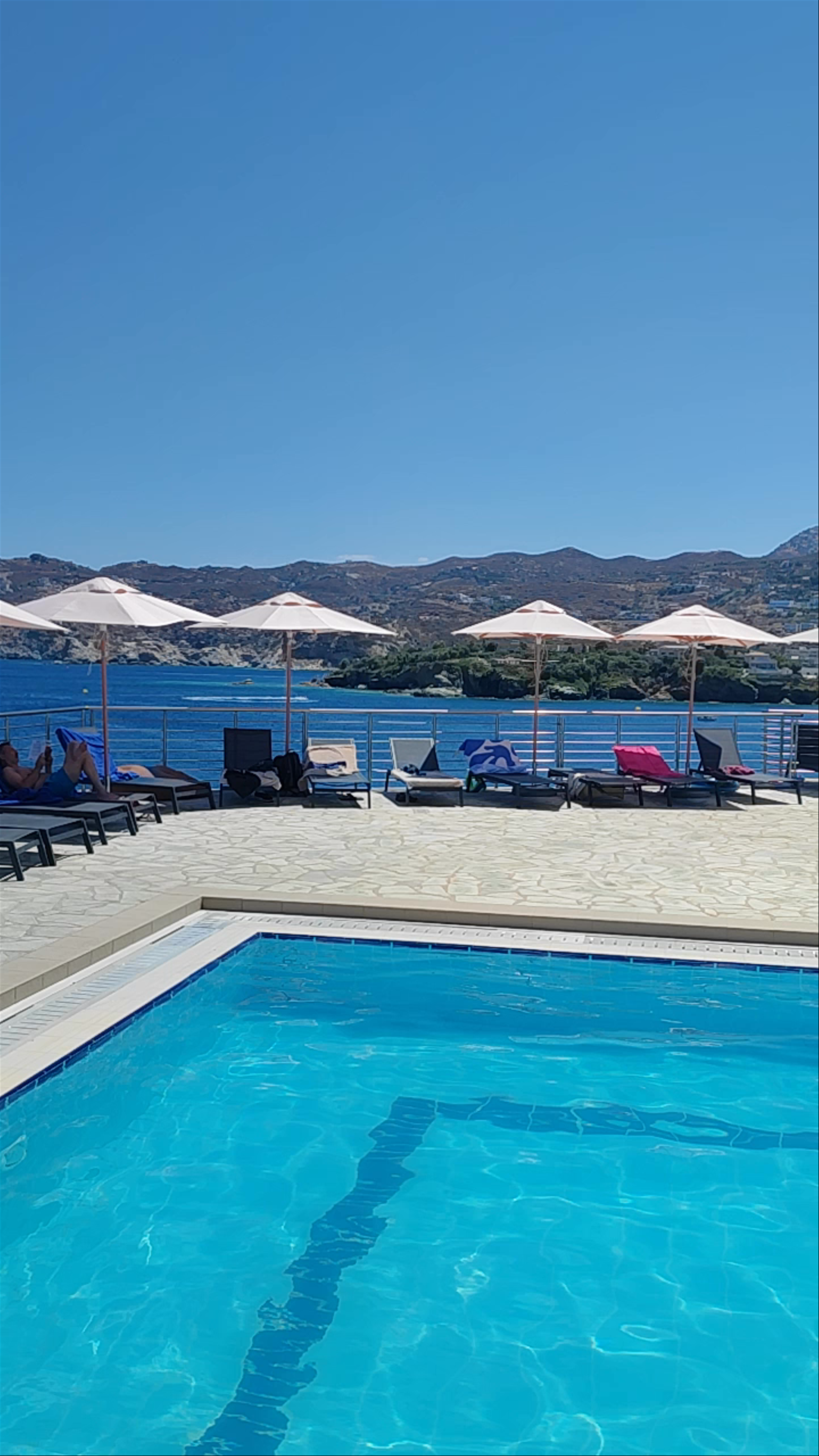 Relaxing Poolside Escape at Peninsula Resort & Spa, Agia Pelagia, Greece
