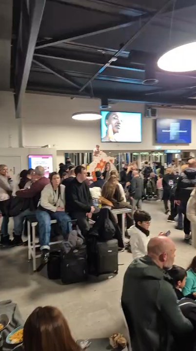 Ryanair - people sleeping on floors and sitting on tables and being exhausted - Airlines Near Me - Dublin, D