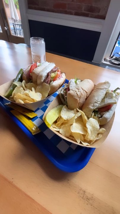 Doug’s Deli - Doug's sub with roast beef and a Chicken Pesto Sub with chips and a pickle - Delis Near Me - Manassas, Virginia