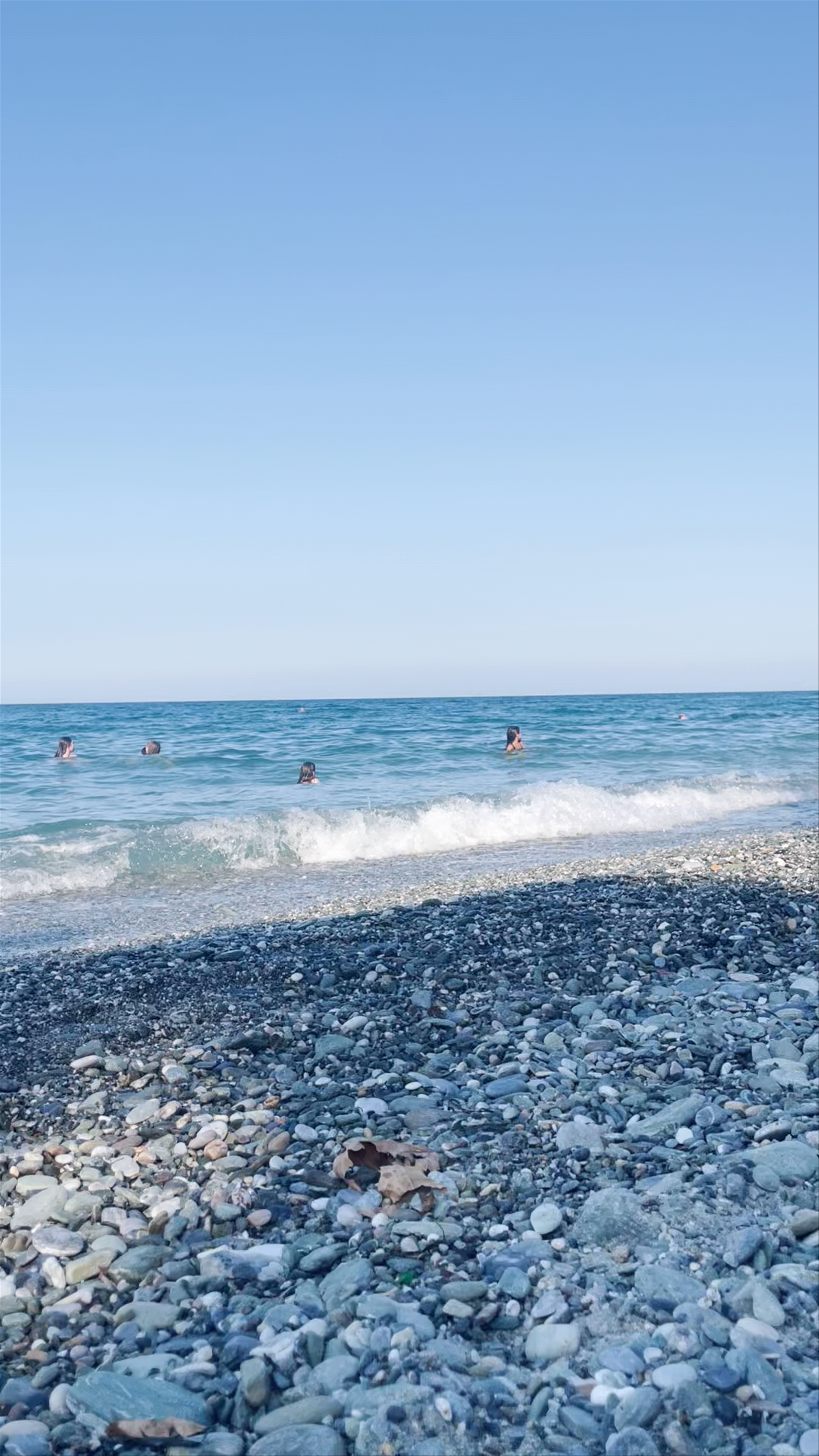 Sunlit Pebble Beach at Villa Moskoff, East Olympos, Greece