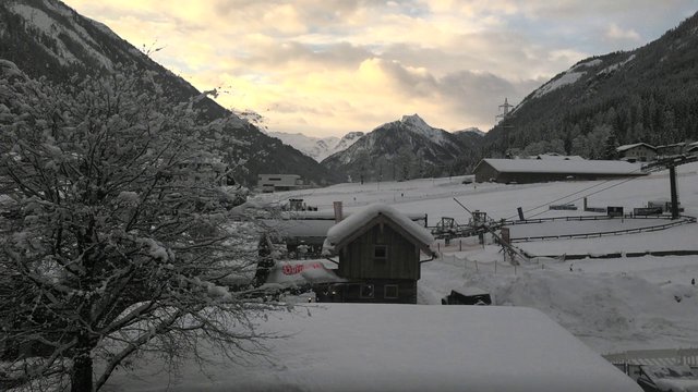 A snowy setting with a ski slope