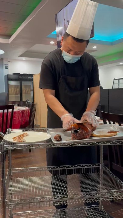 Royal Kitchen - Cutting the duck at your table - Chinese Near Me - Plano, Texas