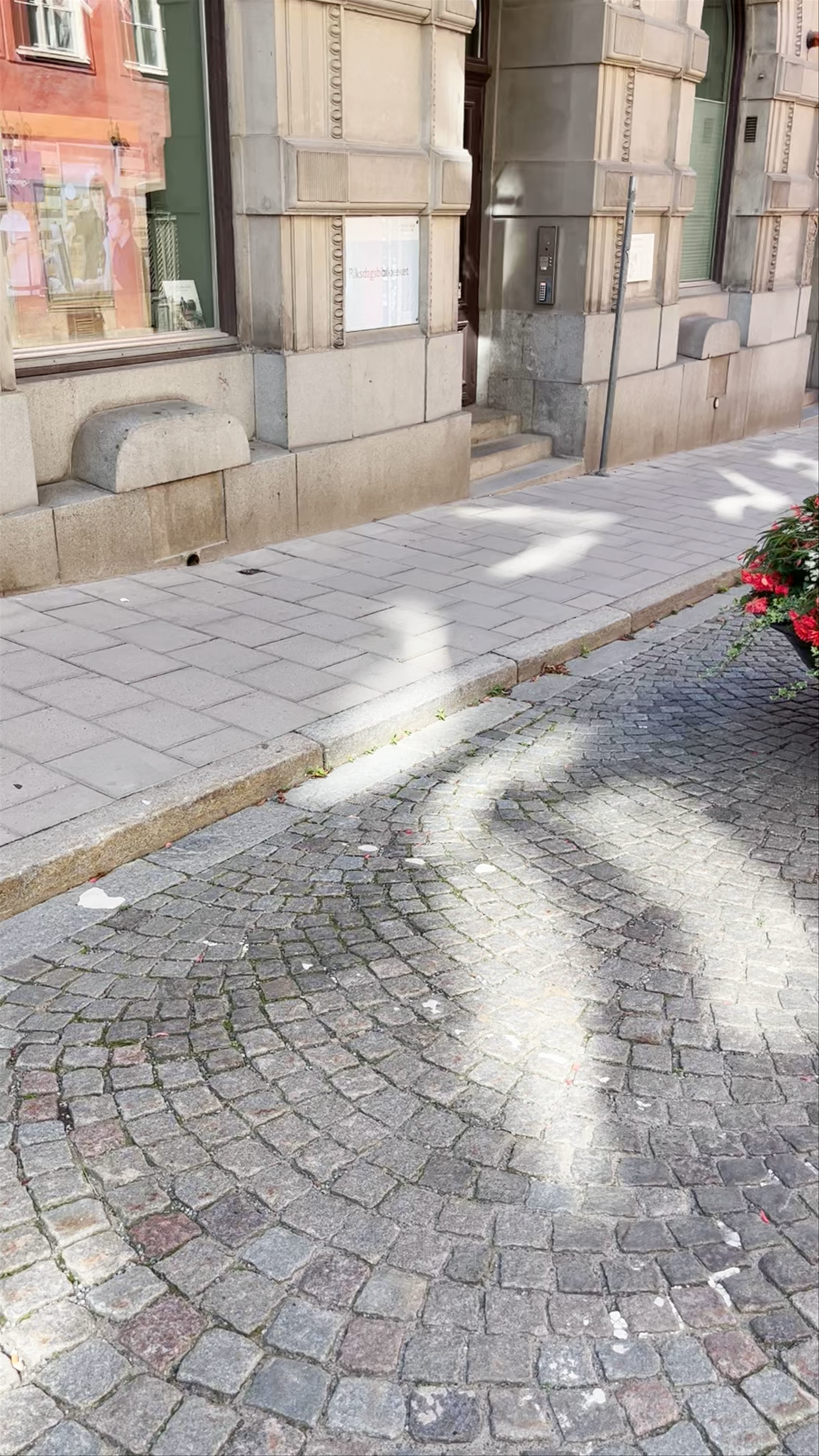 Charming Sunlit Cobblestone Street in Historic Stockholm