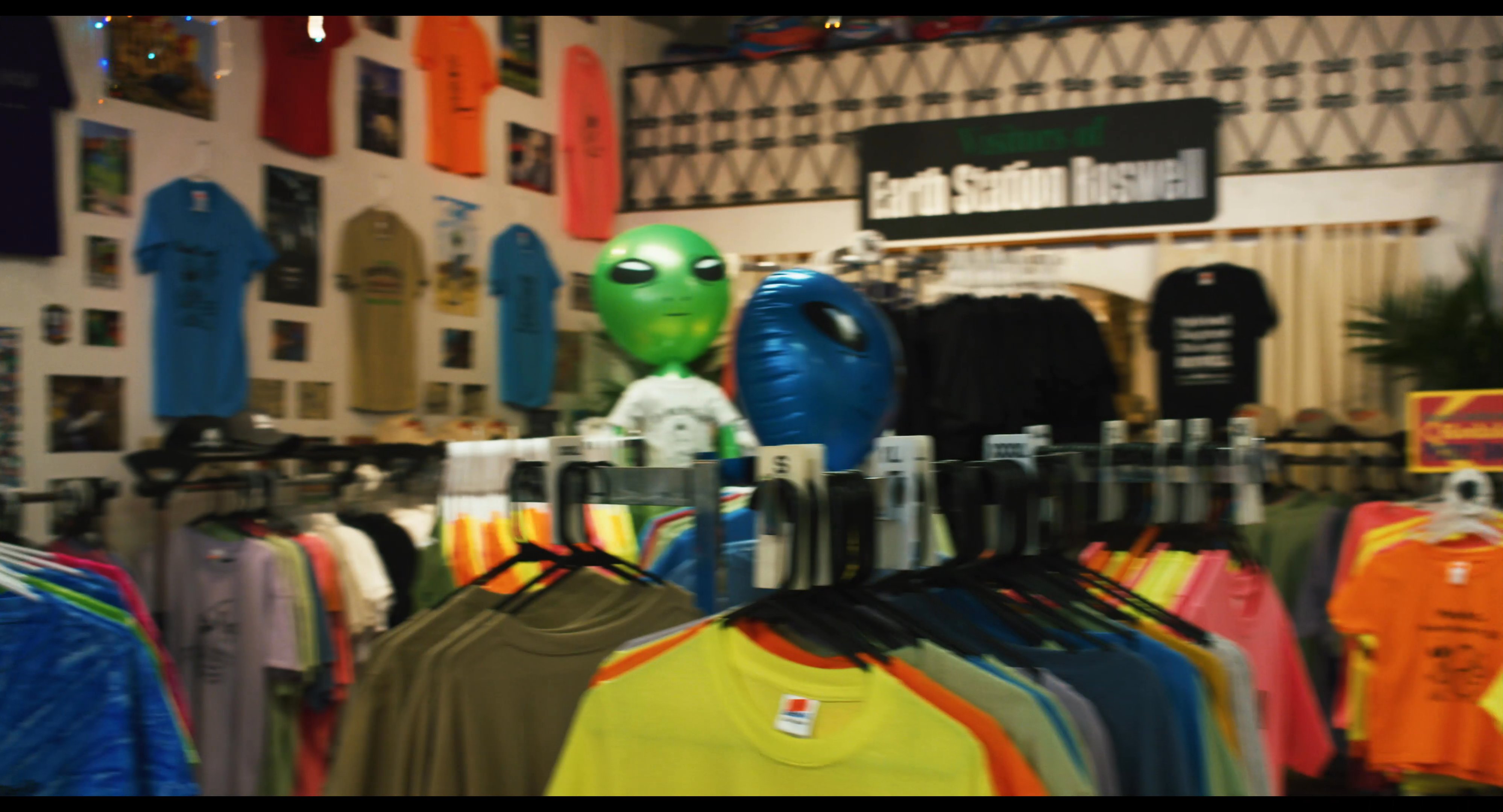 A visitor explores the Earth Station Roswell museum and gift shop, which features extraterrestrial-themed displays and merchandise.