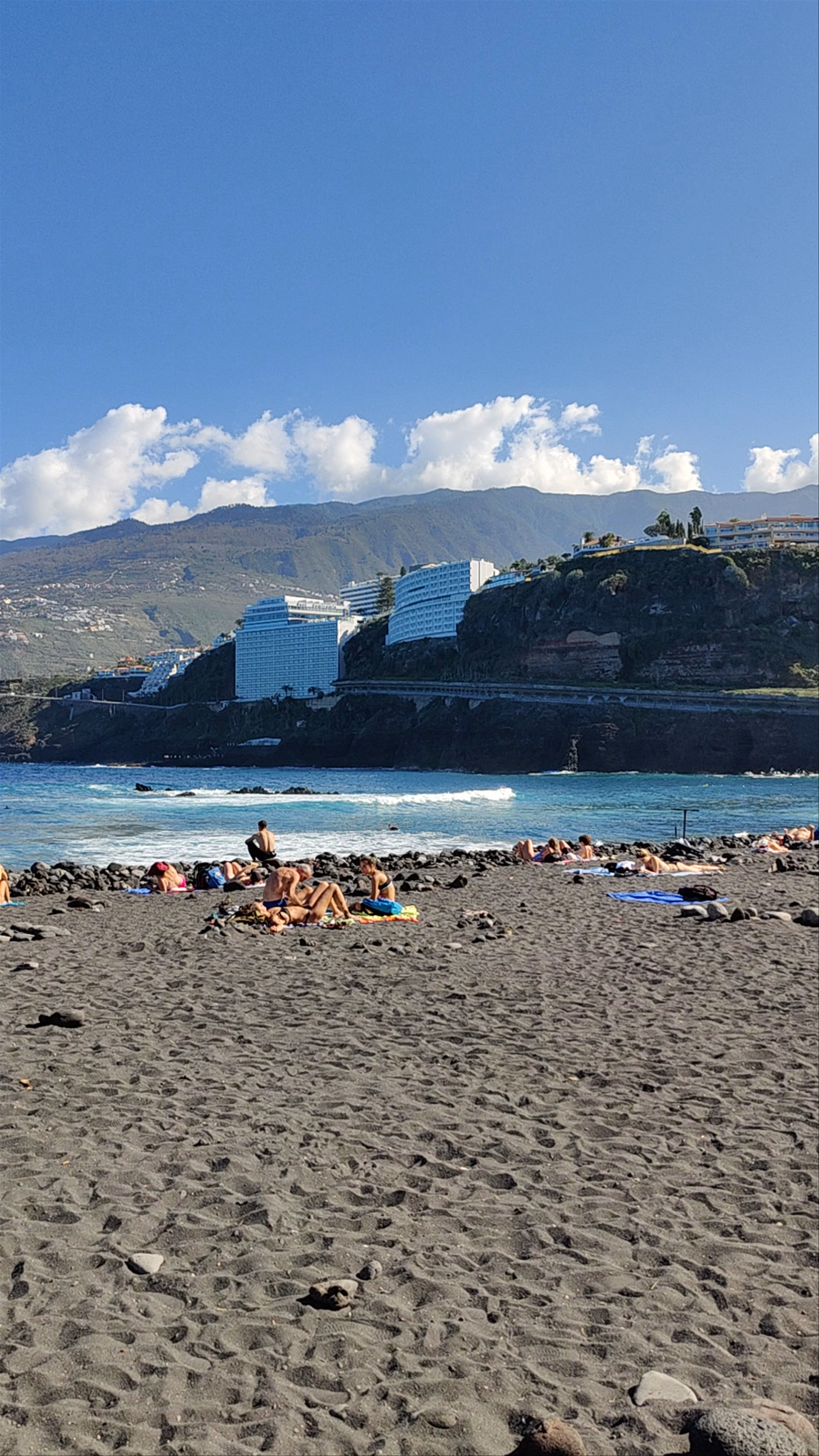 Sunbathing and Coastal Views at Playa de La Barranquera, Puerto de la Cruz
