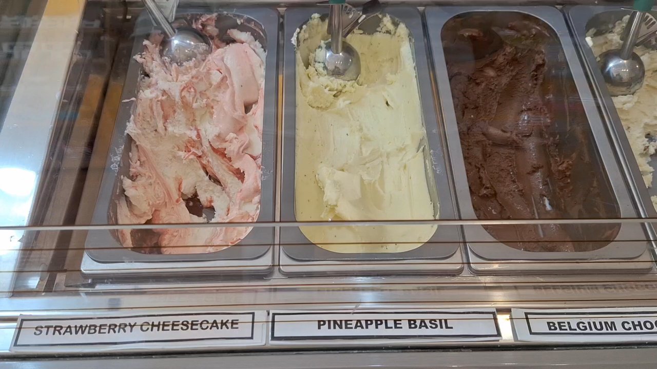 Claude's Chocolate - This is a pan of the available gelato/ice cream flavors on the day I visited and I opted for strawberry cheesecake and Belgium chocolate - Chocolatiers & Shops Near Me - St. Augustine, Florida