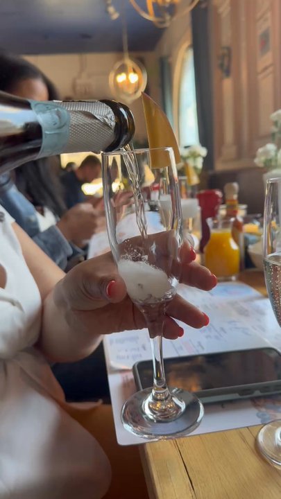 Azul 18 - Serving champagne - New American Near Me - Chicago, Illinois