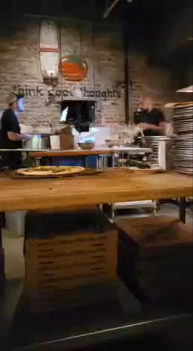 American Flatbread - We had a fantastic dining experience here.  The salad was so fresh and light.  The pizza was amazing.  Here is Joey spinning the doe. - Pizza Near Me - Somerville, Massachusetts