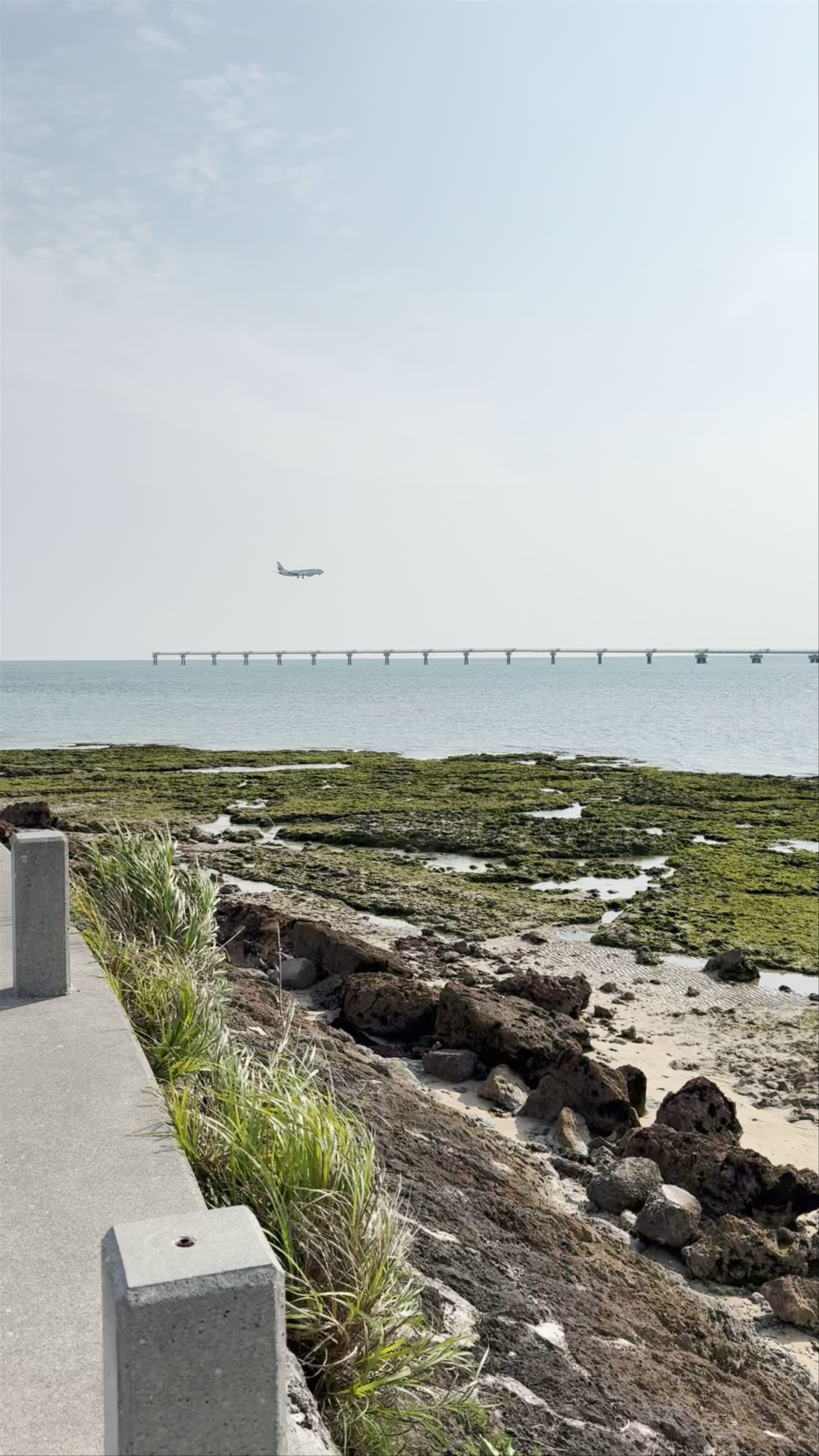 Serene Coastal Views and Airplane Landing at Umikaji Terrace in Okinawa