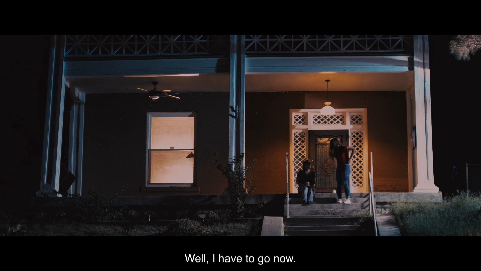 A mother and daughter share a heartfelt, supportive conversation on a porch at night before bidding each other an emotional farewell.