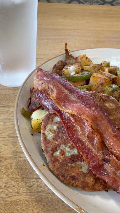 AM Goodness Cafe - This was the biscuits and gravy plate. 2 slices of bacon , sausage patty, two eggs sunny side up, homestyle potatoes - Cafes Near Me - Vista, California
