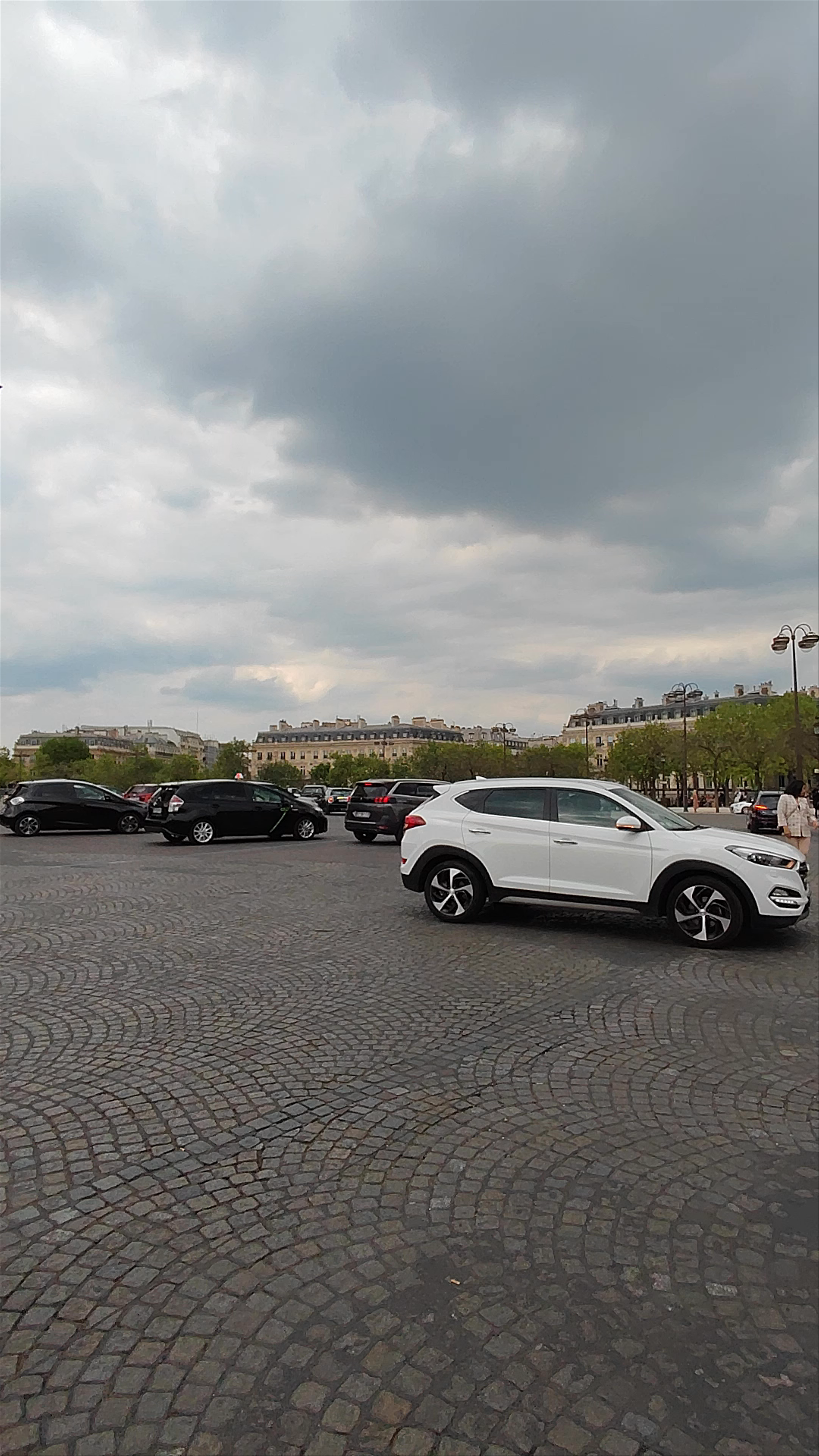 Arc de Triomphe: Iconic Parisian Landmark under Dramatic Skies