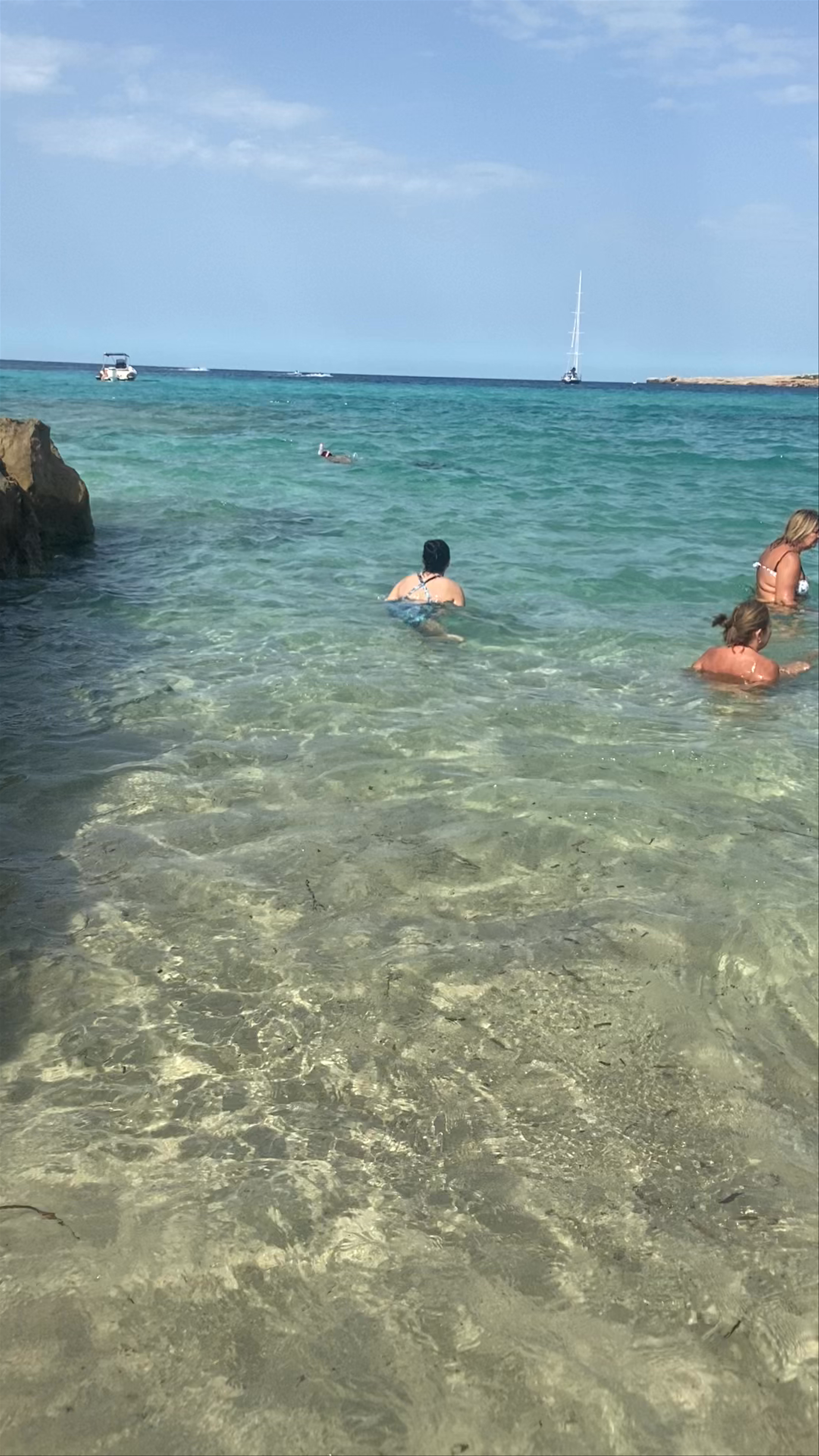 Cala Comte: Crystal Clear Waters and Sun-Kissed Shores in Ibiza