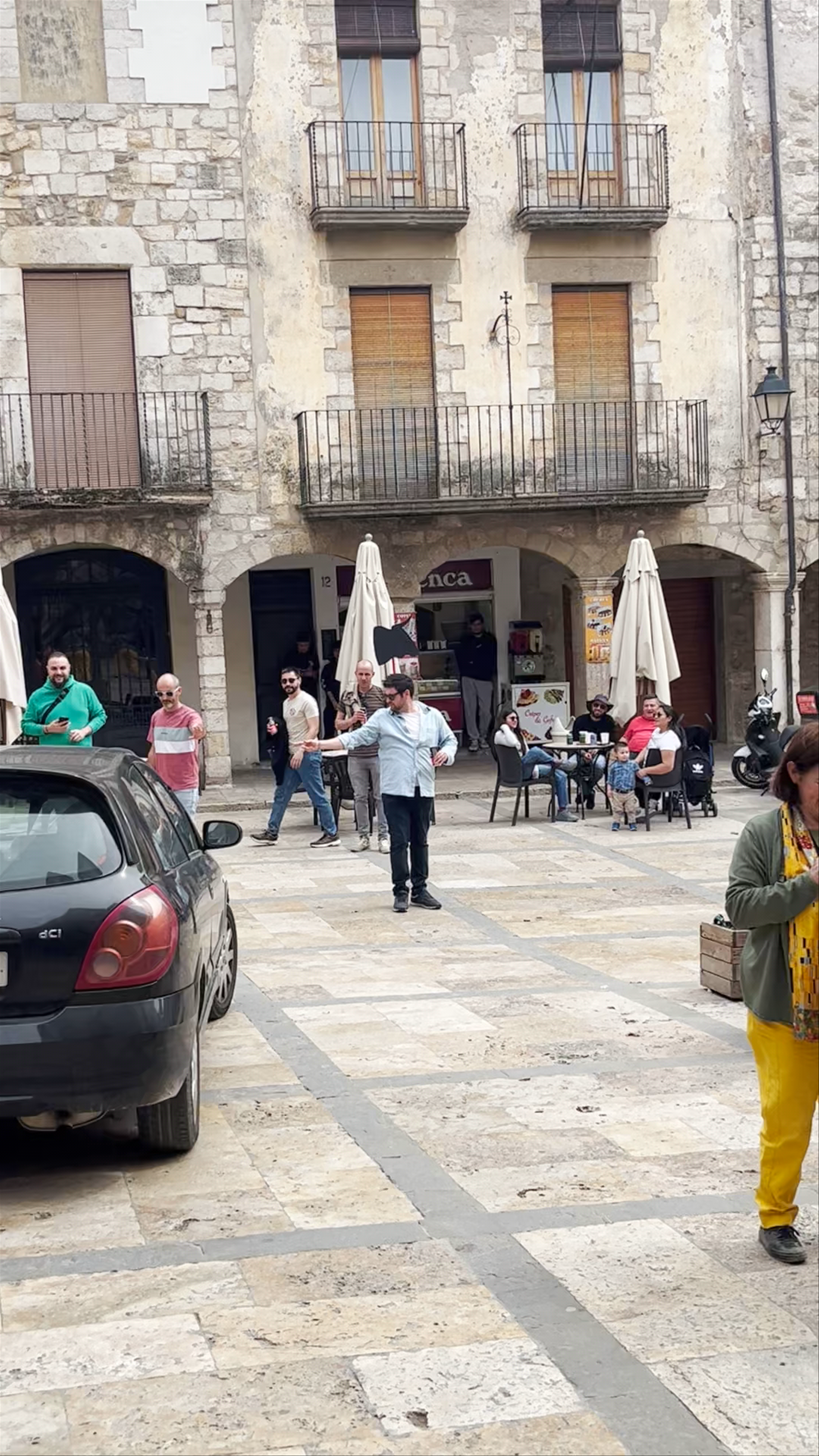 Cultural Plaza Life and Street Performers in Besalú, Spain