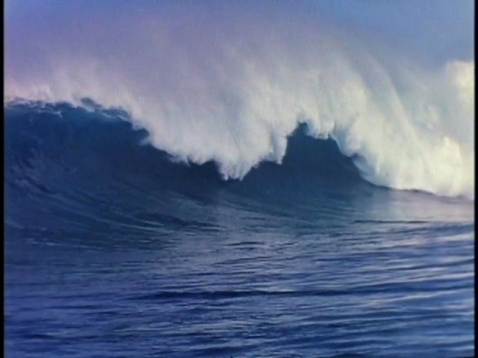 Surfers navigate rolling ocean waves in tandem, transitioning to vintage black-and-white footage of practitioners posing with their boards on land.
