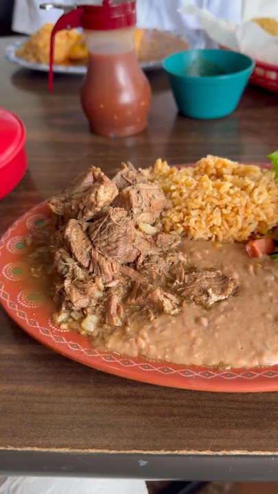 Vazquez Restaurant - Carne Guisada plate and Beef Fajitas Enchiladas served with rice and beans - Mexican Near Me - Austin, Texas