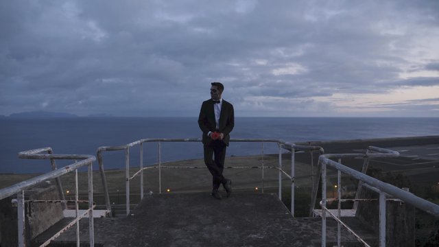 Man with Halloween makeup on a platform