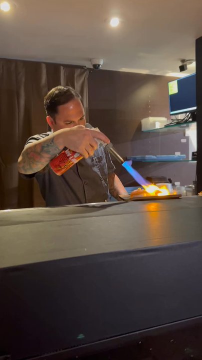 Toyosu - Chef torching salmon - Sushi Bars Near Me - San Juan, Puerto Rico