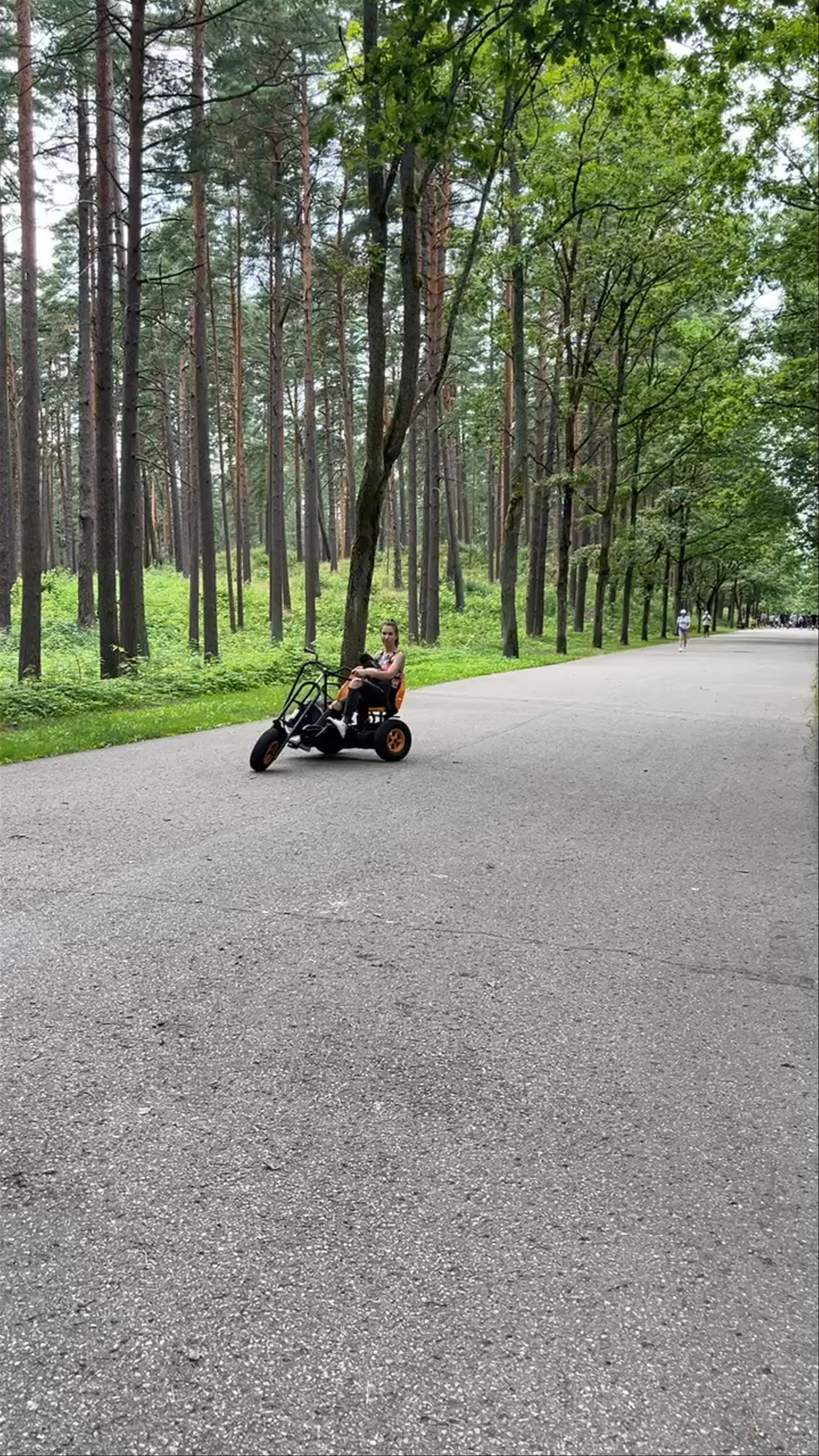 Cruising Through Mežaparks Great Bandstand in Riga's Lush Forest