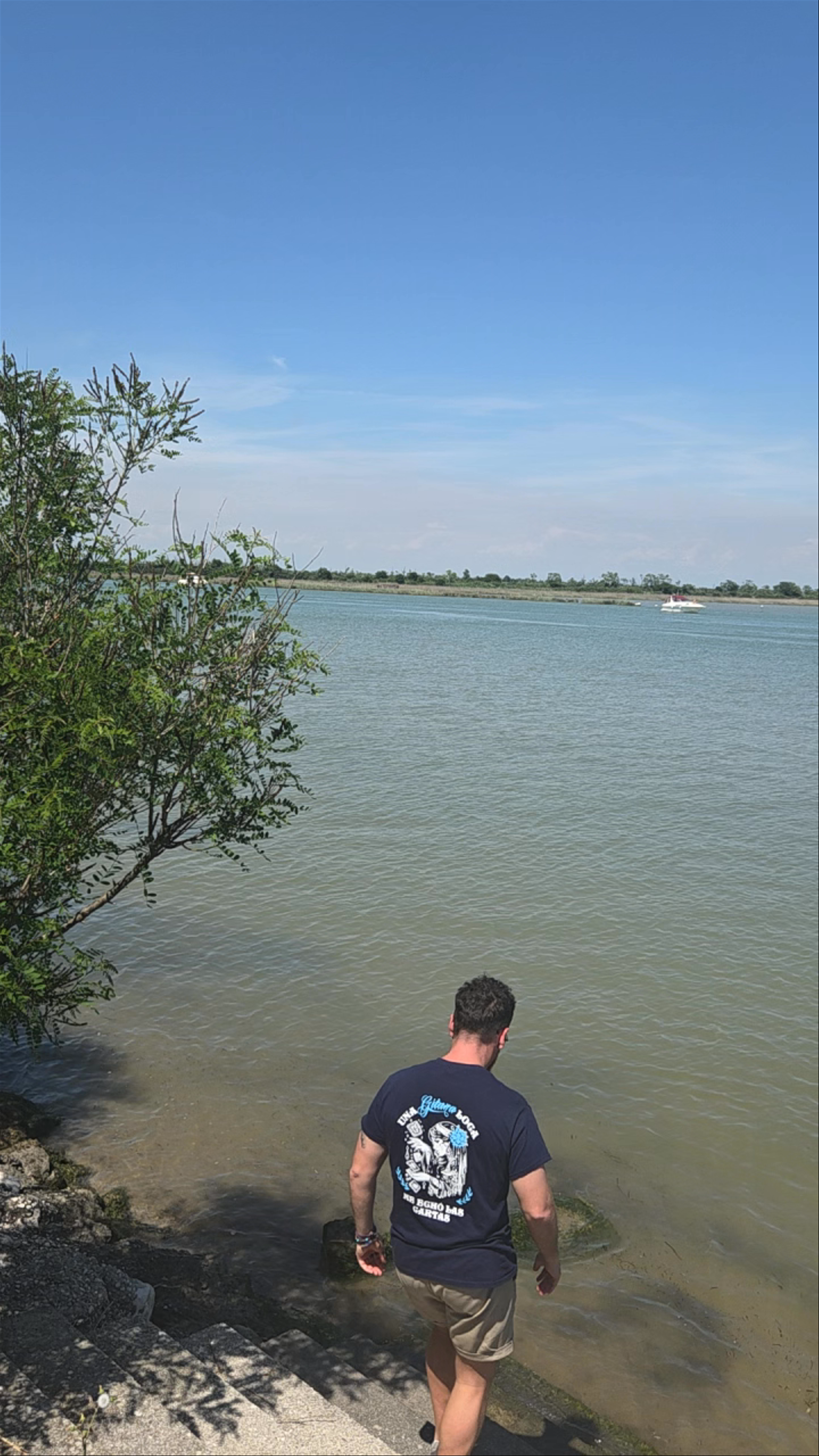Serene Waters and Sunlit Stroll at Laguna di Caorle, Italy