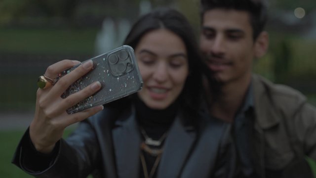 A girl taking a selfie with her boyfriend