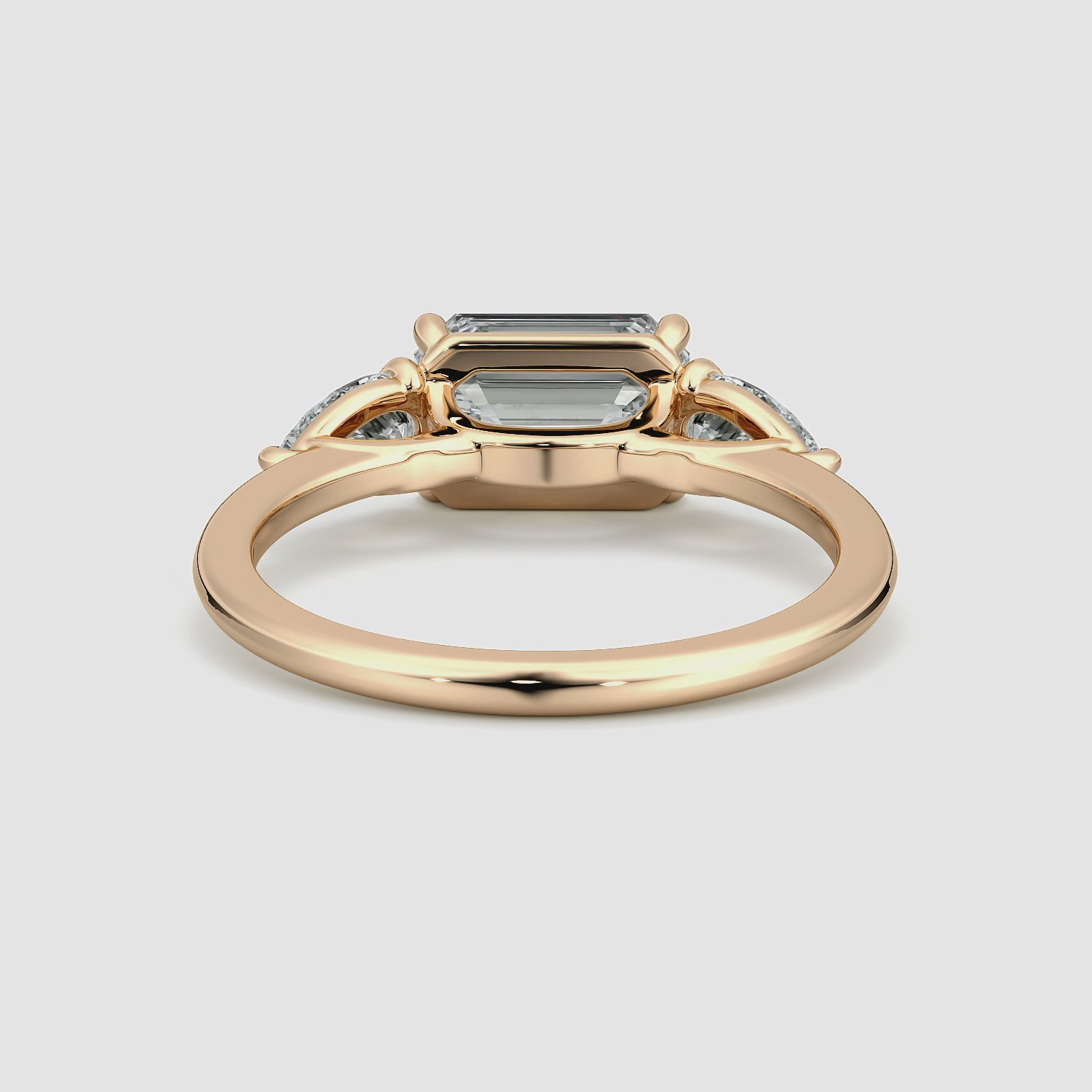 The Three Stone | Emerald | 14k | Rose Gold | bandAccent: Plain | diamondOrientation: horizontal | sideStoneCarat: 0.25ct | sideStoneShape: Pear | caratWeight: other
