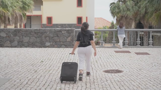 Woman meeting a friend at a hotel