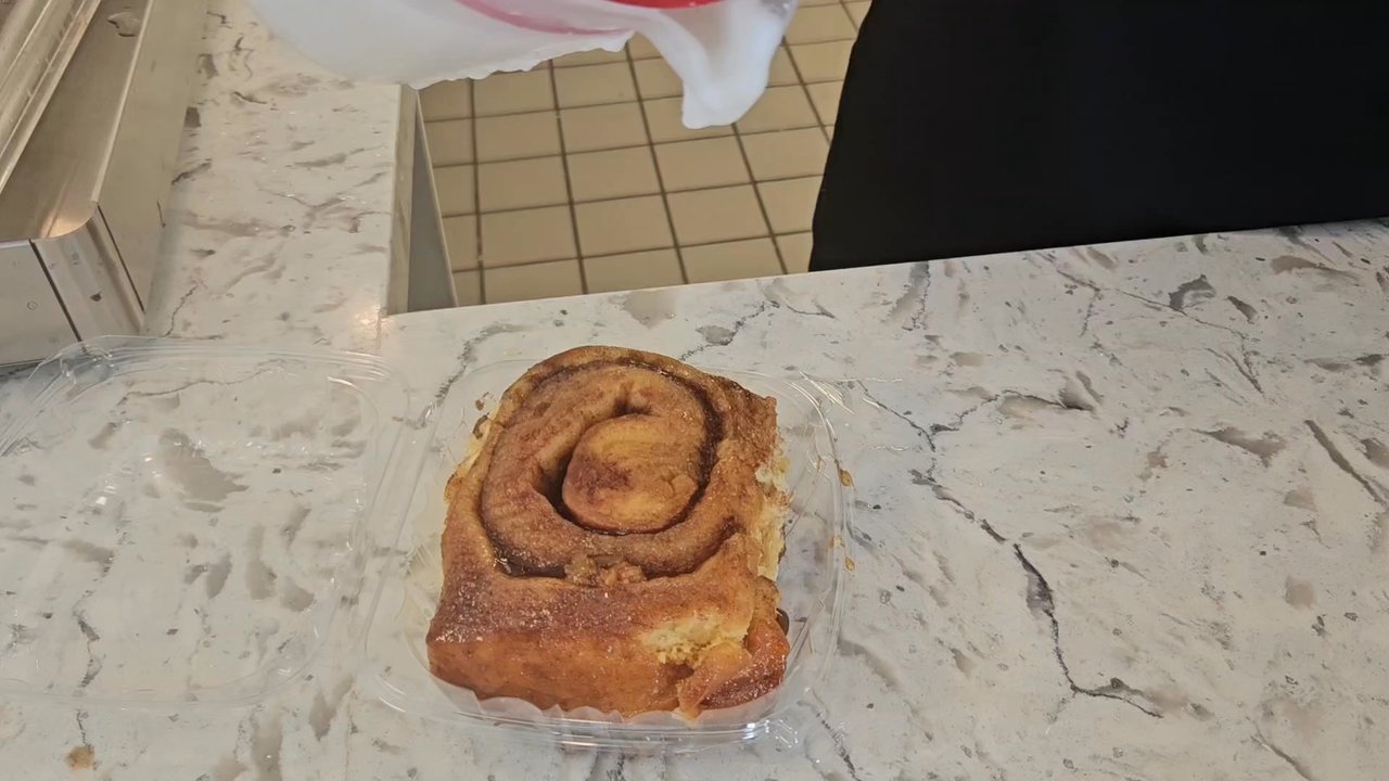 That 1 Bakery - Fresh icing drizzle on their signature, warm cinnamon rolls - Bakeries Near Me - Compton, California