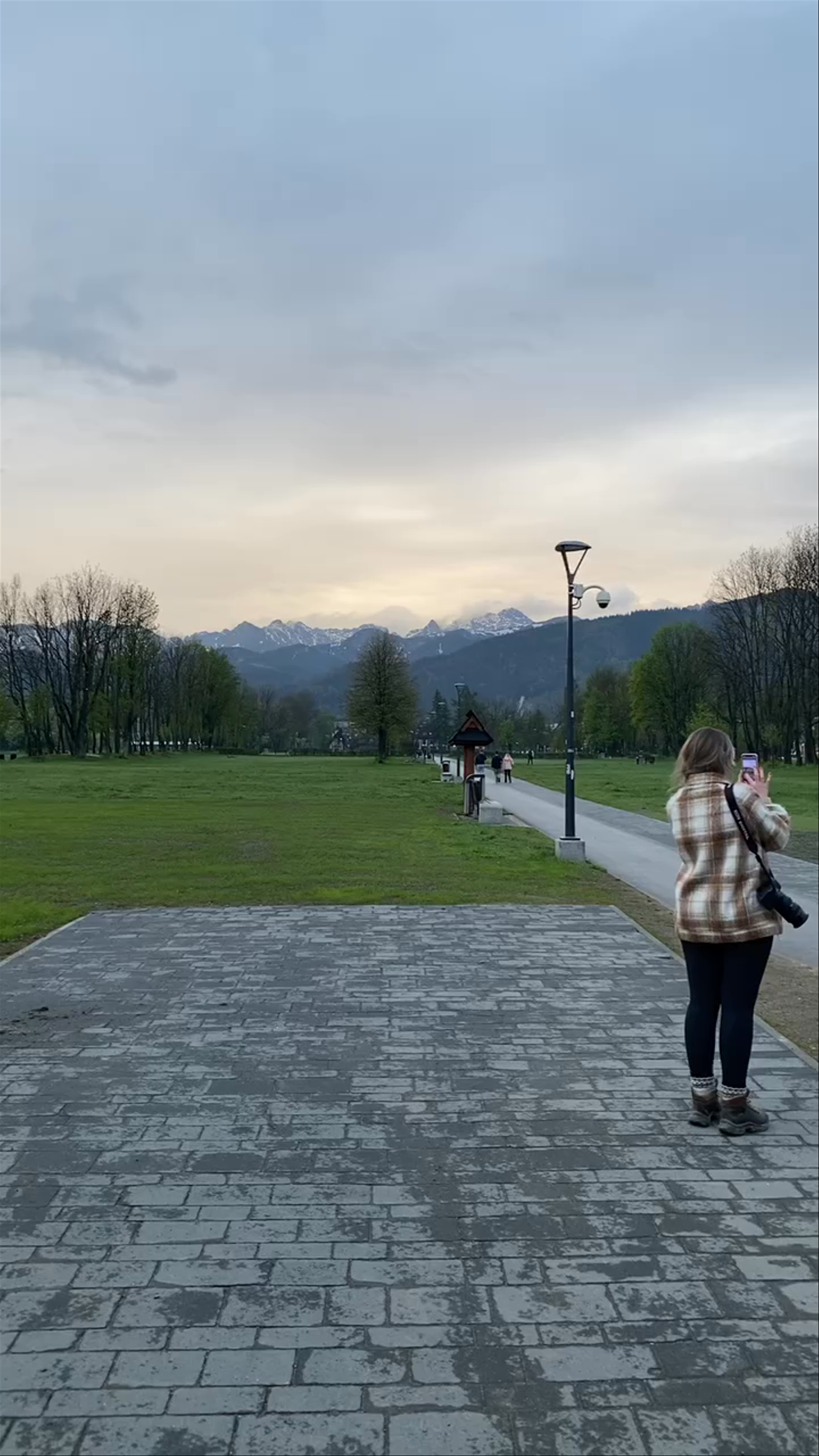 Evening Serenity at Zakopane's Glowing Sign with Mountain Views