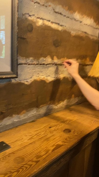 The Owl Bar - Putting pennies in the cracks in the wall like people before us :) - Bars Near Me - Sundance, Utah