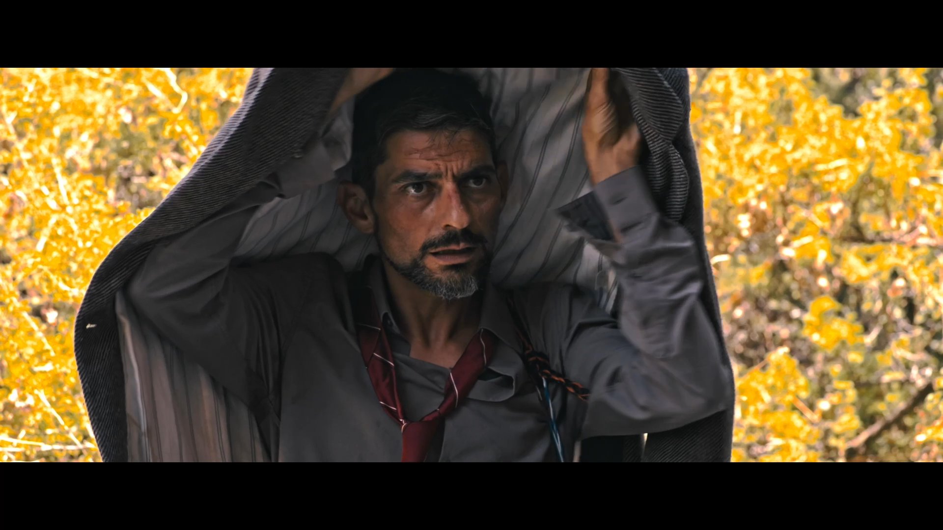 Two individuals navigate an arid, mountainous environment while grappling with extreme heat and interpersonal tension. As they seek shelter and supplies, the harsh conditions intensify their psychological and physical distress.