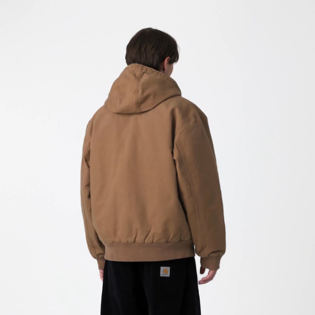 Model wearing an OG Active Jacket in WIP H Brown