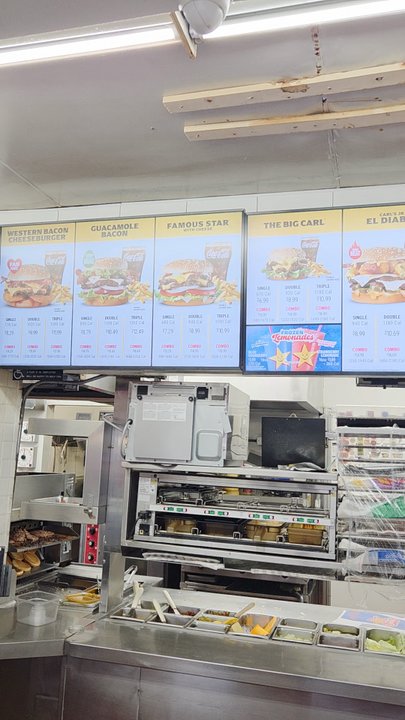 Carl's Jr - Had to video tape the menu inside. Here's Martin hard at work excellent Teamwork with Solis:) - Fast Food Near Me - Banning, California