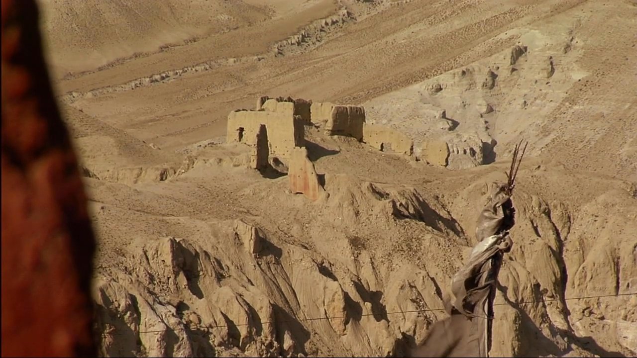 The 14th Dalai Lama discusses spiritual principles while interspersed shots depict Tibetan monks in traditional surroundings and remote Himalayan historical sites.