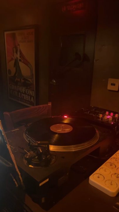Sunset & Vinyl - They have a mid selection of vinyls to choose from to play on the record player - Cocktail Bars Near Me - Los Angeles, California