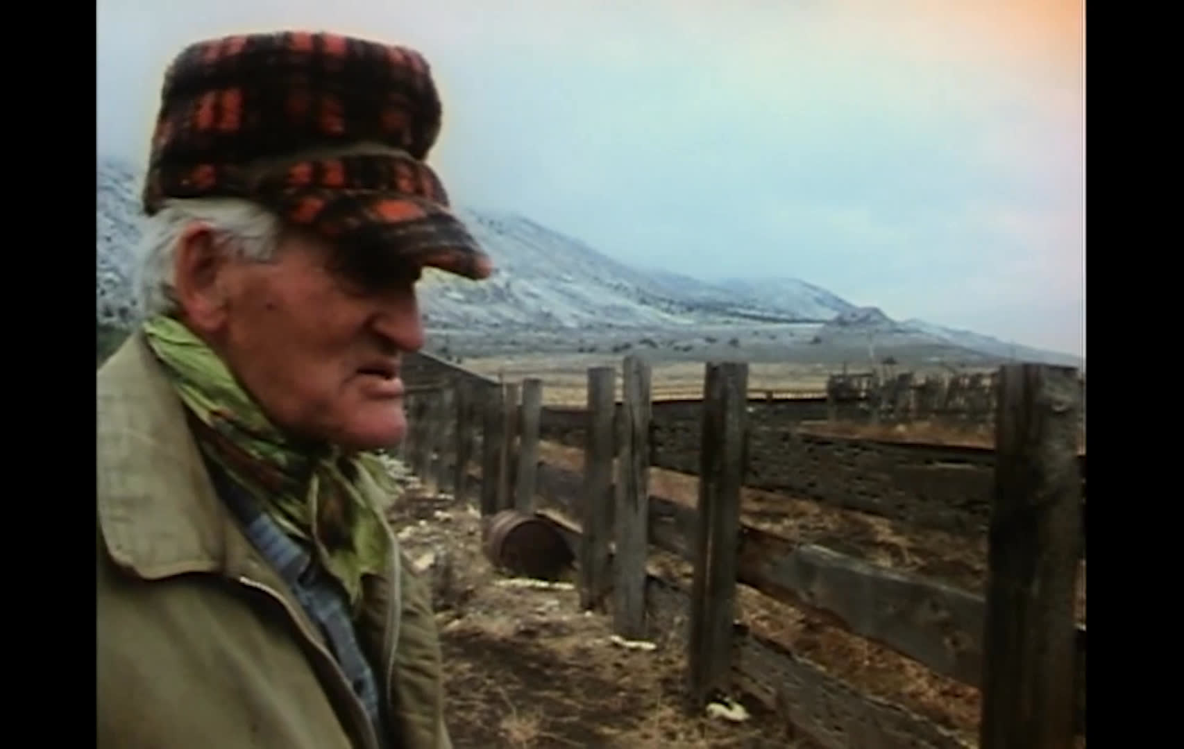 A title card introduces “Gowhand’s Song: Crisis on the Range,” followed by an older rancher speaking beside a weathered fence in an open landscape and a woman speaking indoors. The interviews address the condition of public rangelands and ranchers’ efforts to protect them.