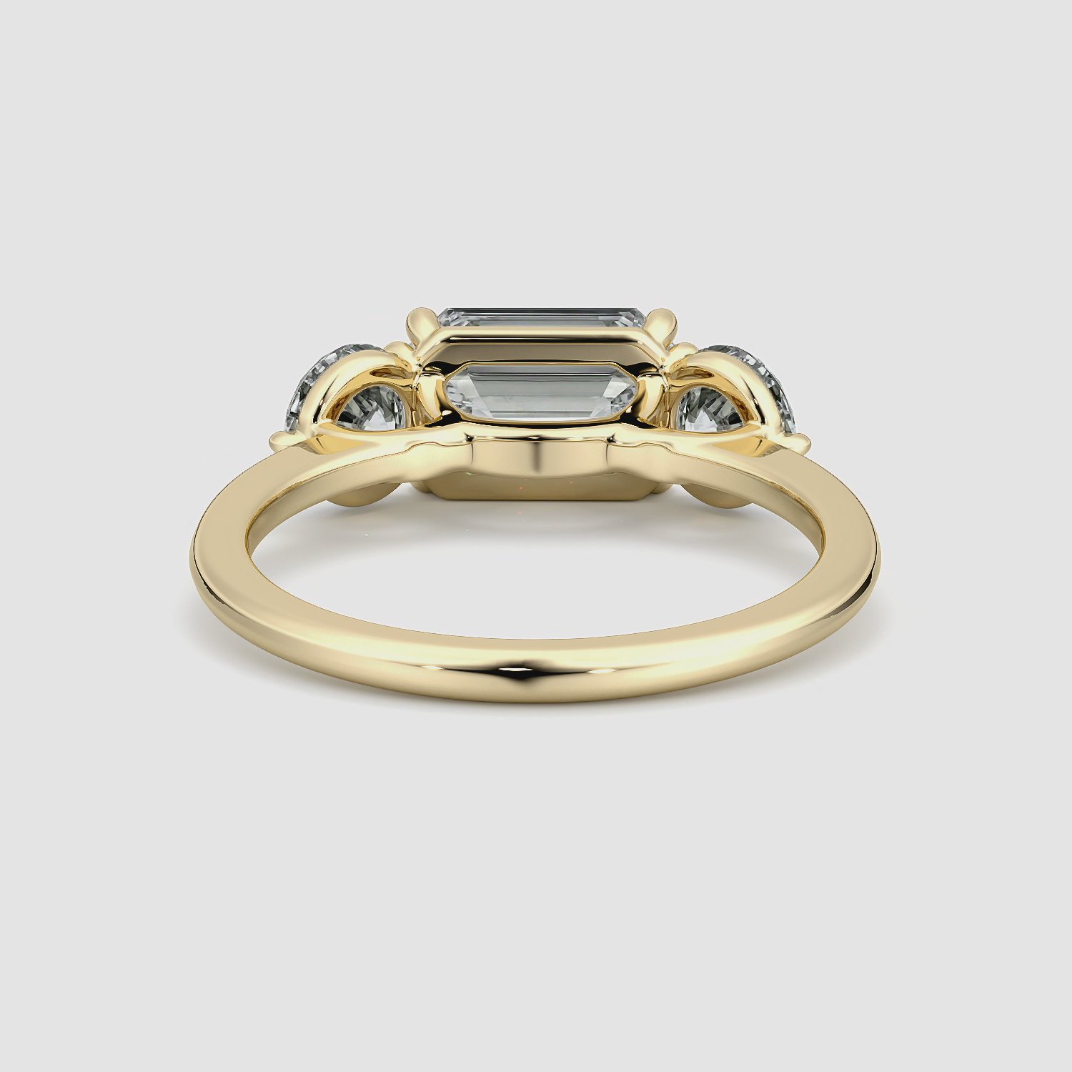 The Three Stone | Emerald | 18k | Yellow Gold | bandAccent: Plain | diamondOrientation: horizontal | sideStoneCarat: 0.50ct | sideStoneShape: Round Brilliant | caratWeight: other