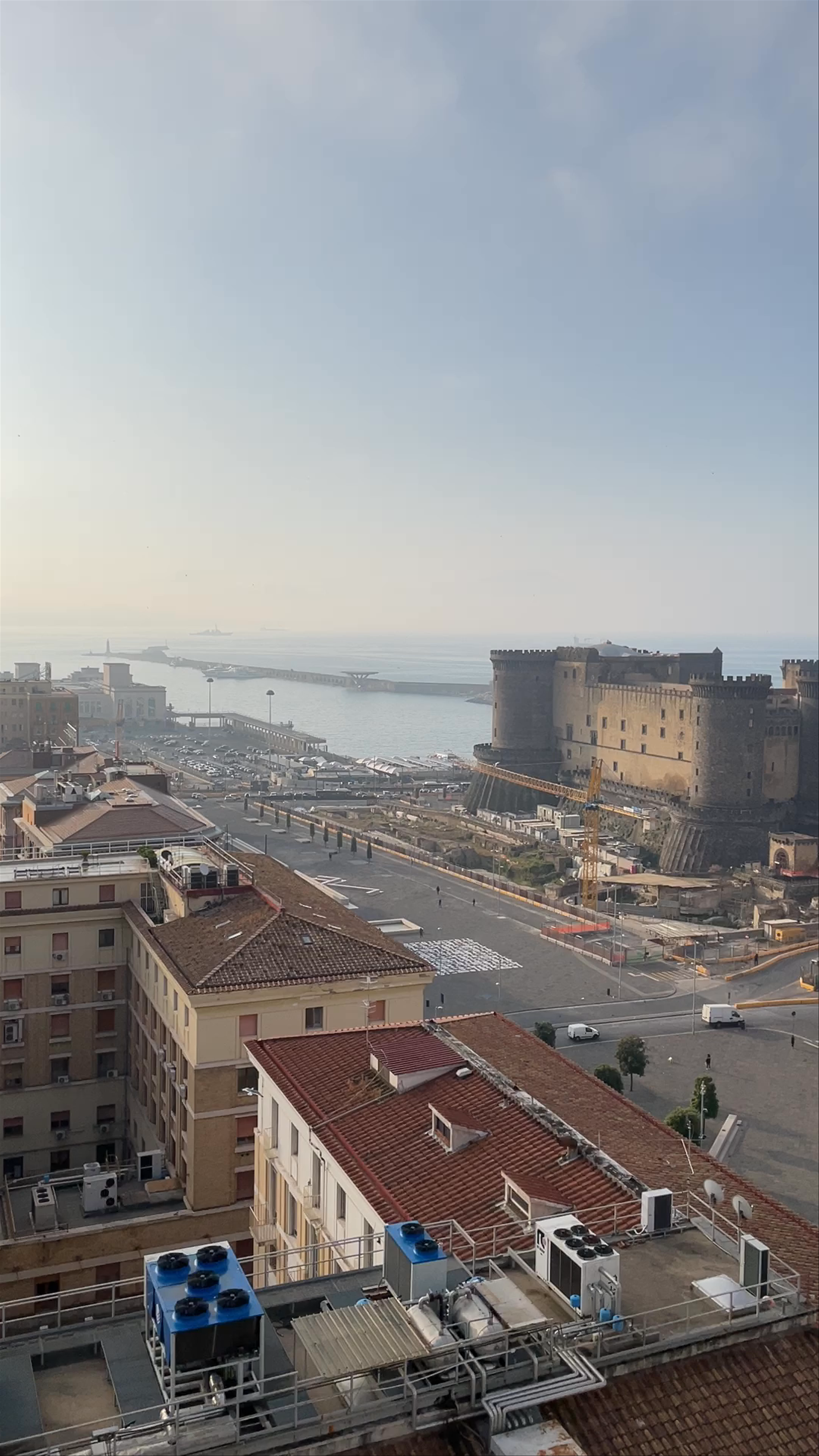Scenic Rooftop Views of Naples with Castel Nuovo in the Distance