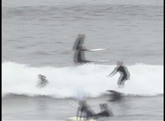 Surfers navigate waves and practice balance on surfboards in a coastal ocean environment. Individuals demonstrate various maneuvers while maneuvering through breaking waves.
