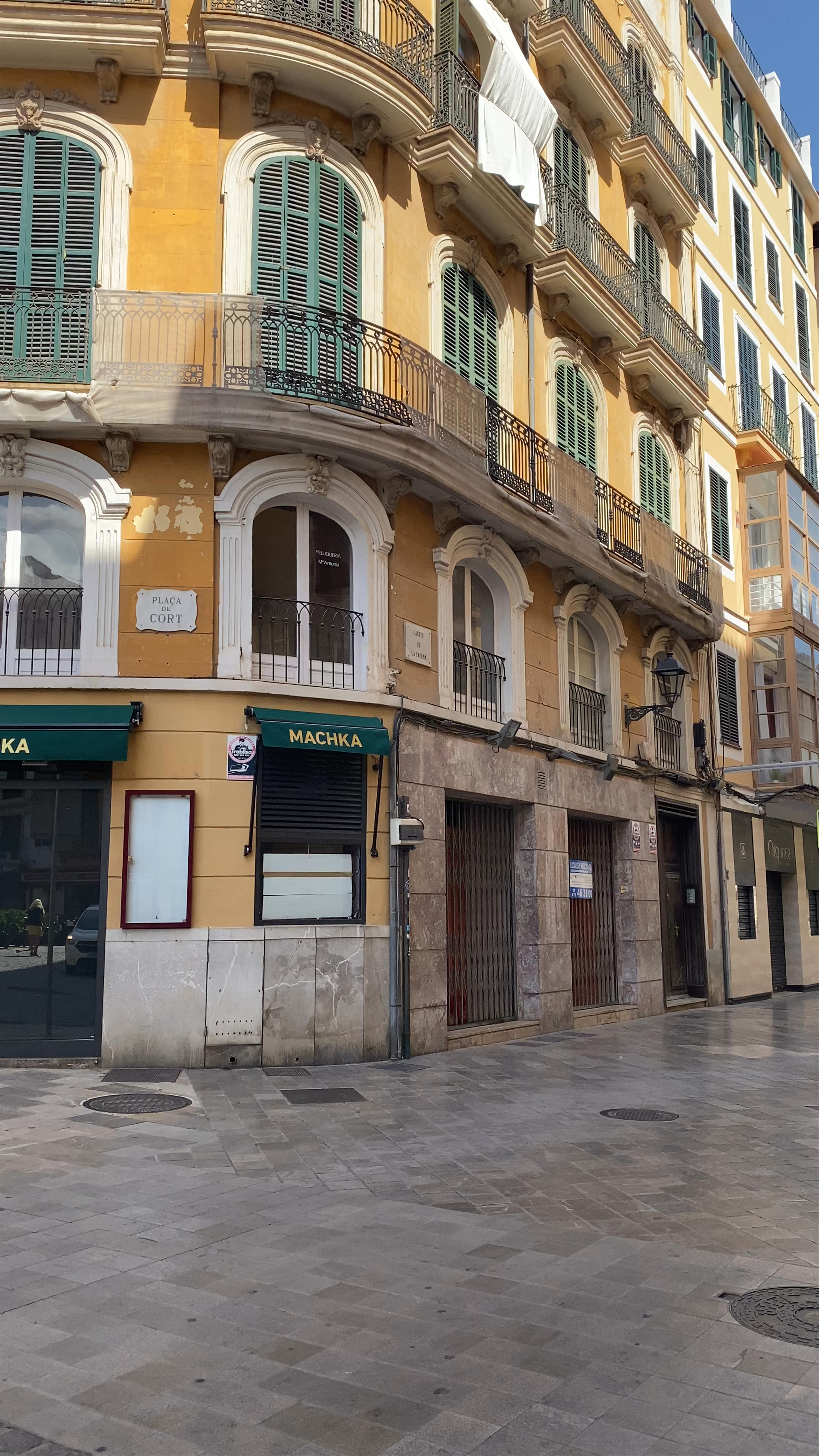 Golden Sunlight over Plaça de Cort, Palma: A Vibrant Mediterranean Square