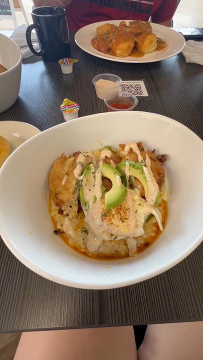 Cajun Breakfast Joint - Order of food shown:  - Crab cake bowl with grits  - Salmon and grits (praline cornbread next to the bowl) - Crawfish Gravy and Biscuits - Breakfast & Brunch Near Me - Phoenix, Arizona