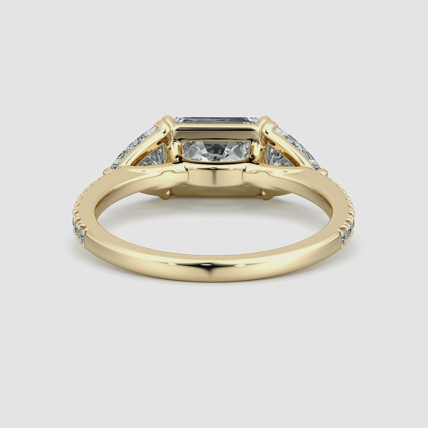 The Three Stone | Radiant | 18k | Yellow Gold | bandAccent: Pavé | diamondOrientation: horizontal | sideStoneCarat: 0.50ct | sideStoneShape: Trillion | caratWeight: other