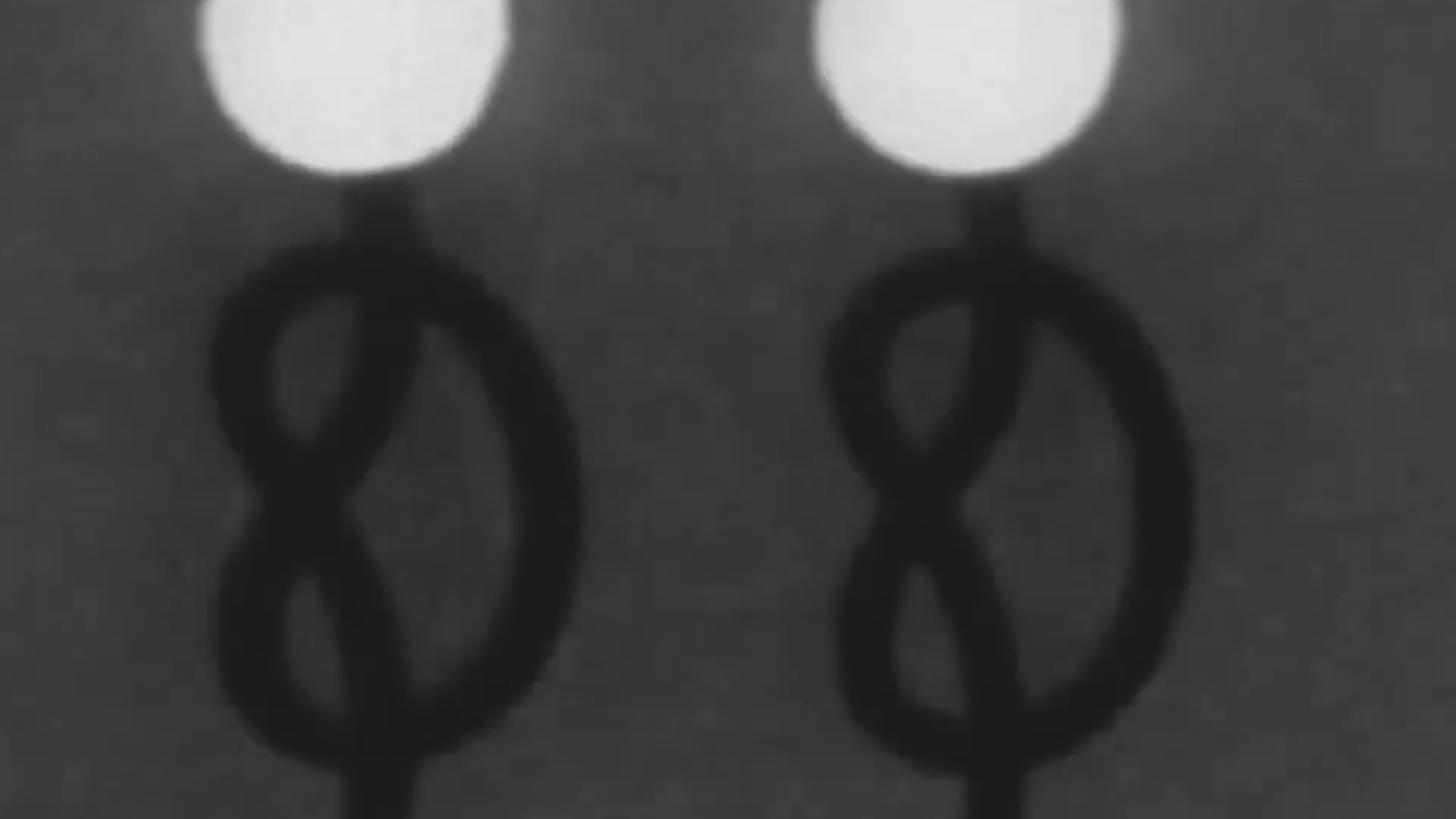 A stop-motion sequence features a small hedgehog figurine amidst stylized, surreal lighting and transitions, concluding with introductory title cards and production credits.
