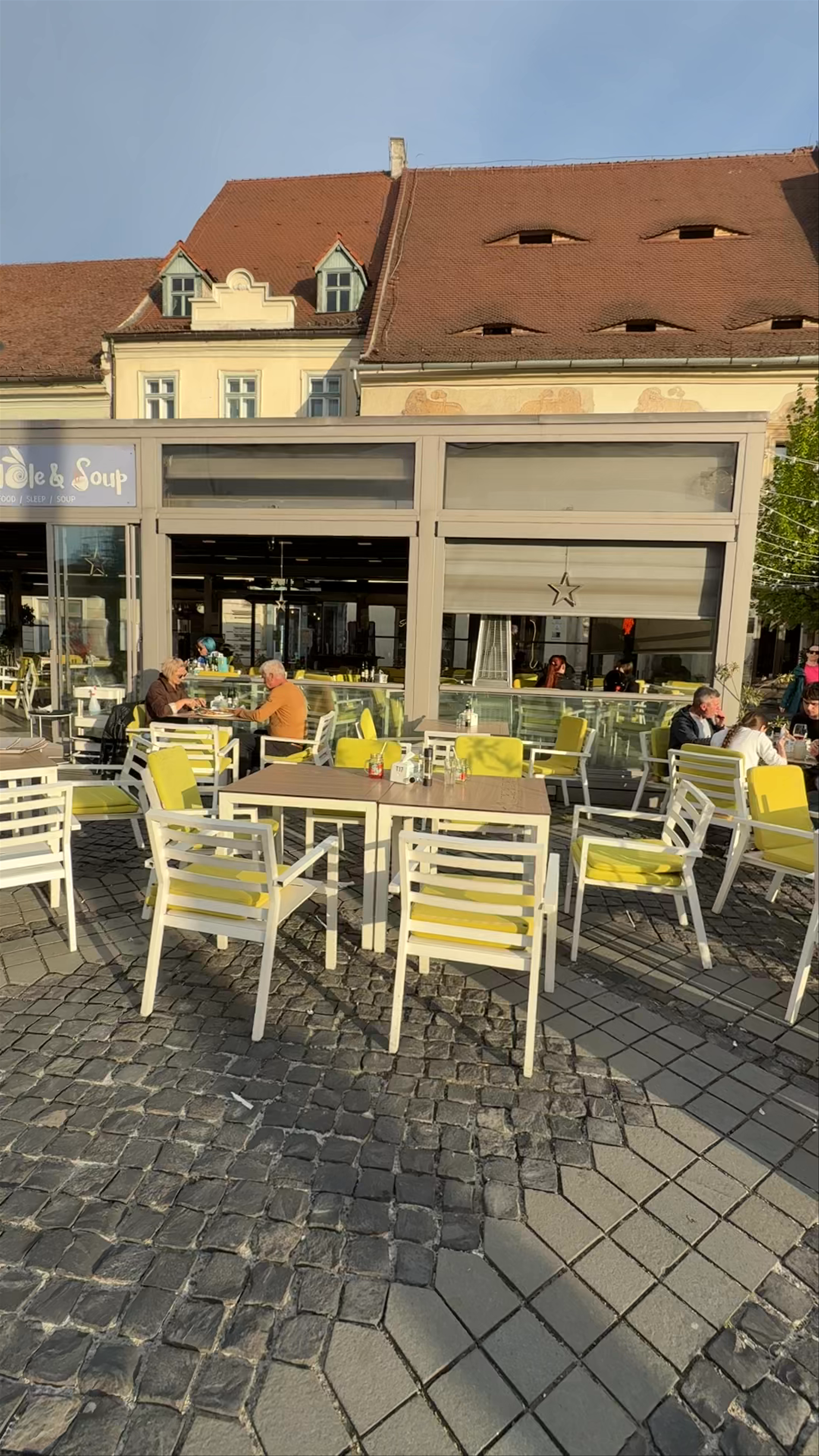 Golden Hour at The Rabbit Hole Restaurant, Sibiu's Historic Piața Mare