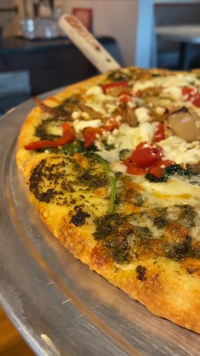 Frabotta's Beach Kitchen - The Diana (House Favorite)  Pesto base, goat cheese, italian sausage, roasted red peppers, spinach and caramelized onions. - Pizza Near Me - Madeira Beach, Florida